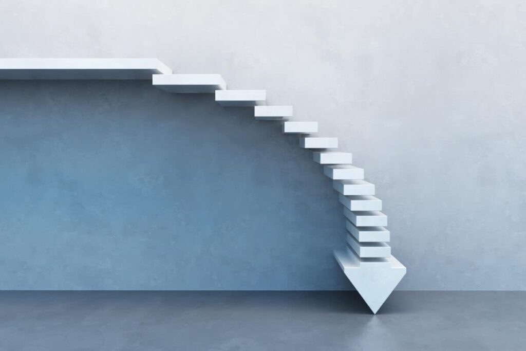 This Monthly Dividend Stock Is Still Cheap. Falling Rates Could Change That crisis concept, falling stairs